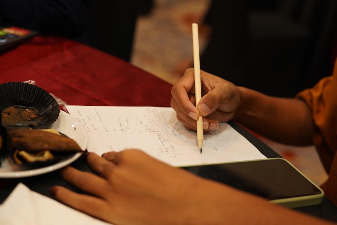 person taking notes during workshop