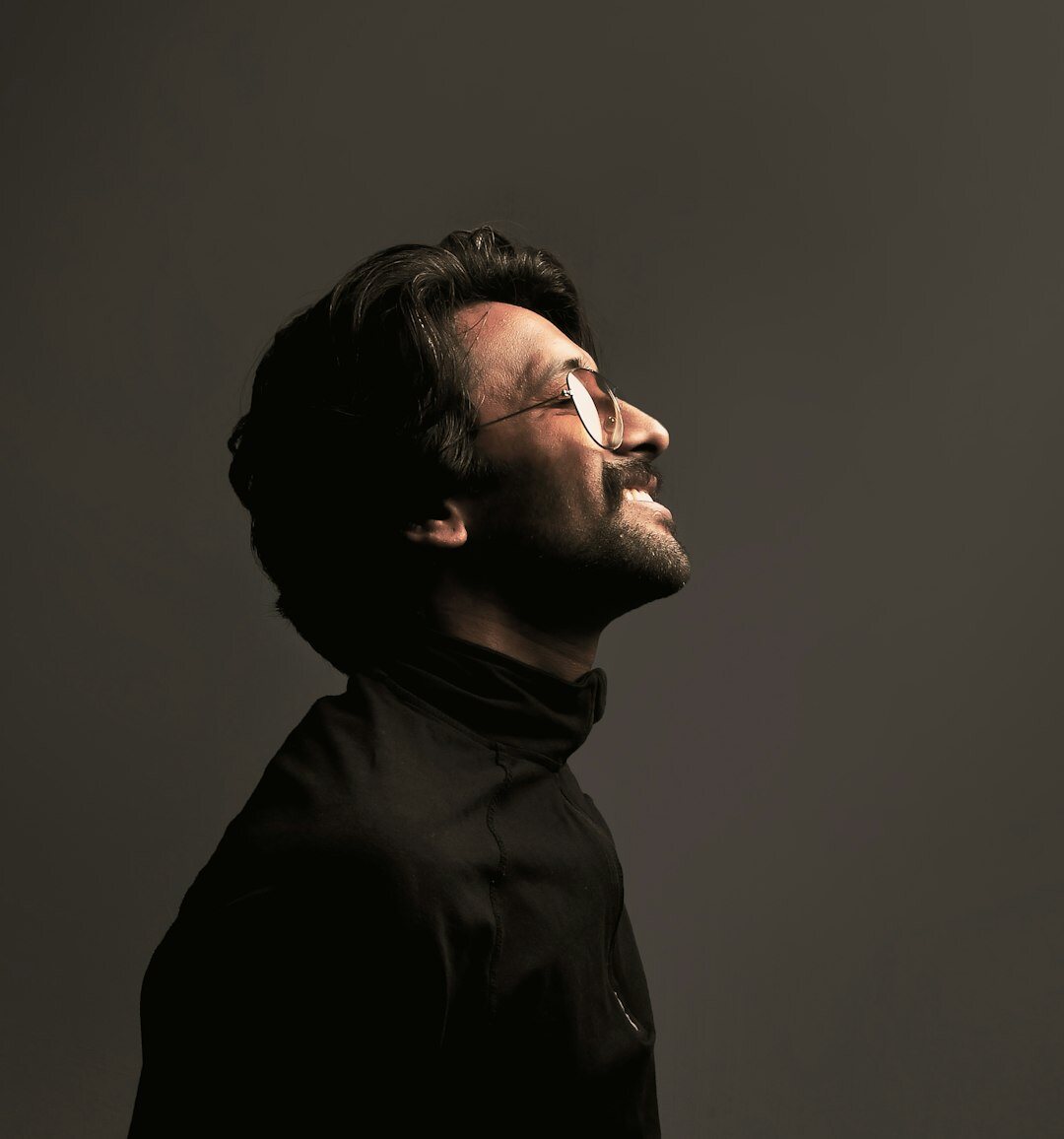 Portrait of a Brazilian man with short dark hair smiling