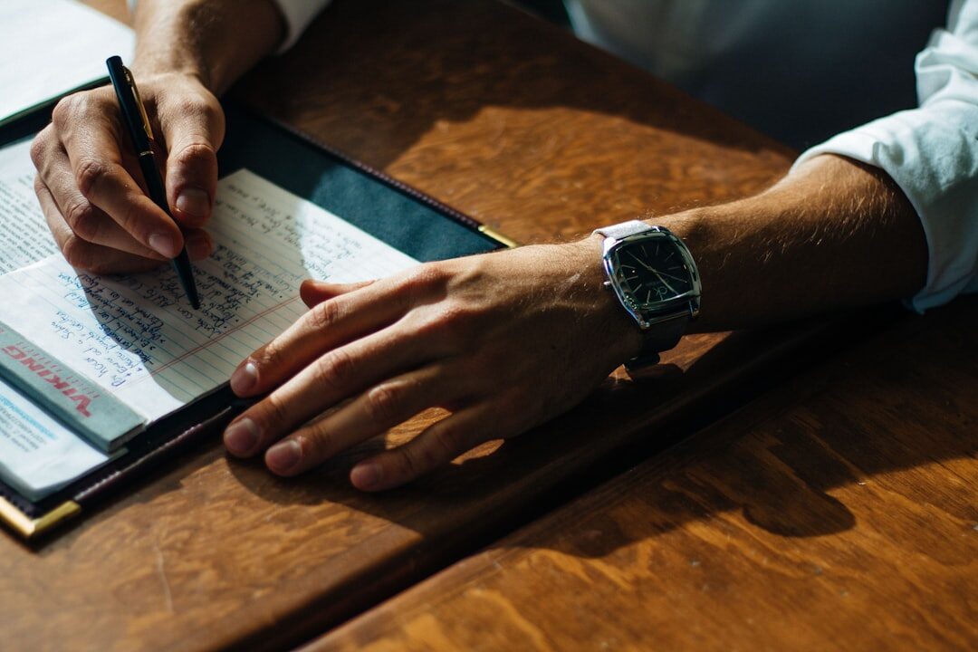person writing in journal